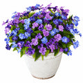 Plante fleurie artificielle en pot 65 cm textile violet bleu décoration intérieure